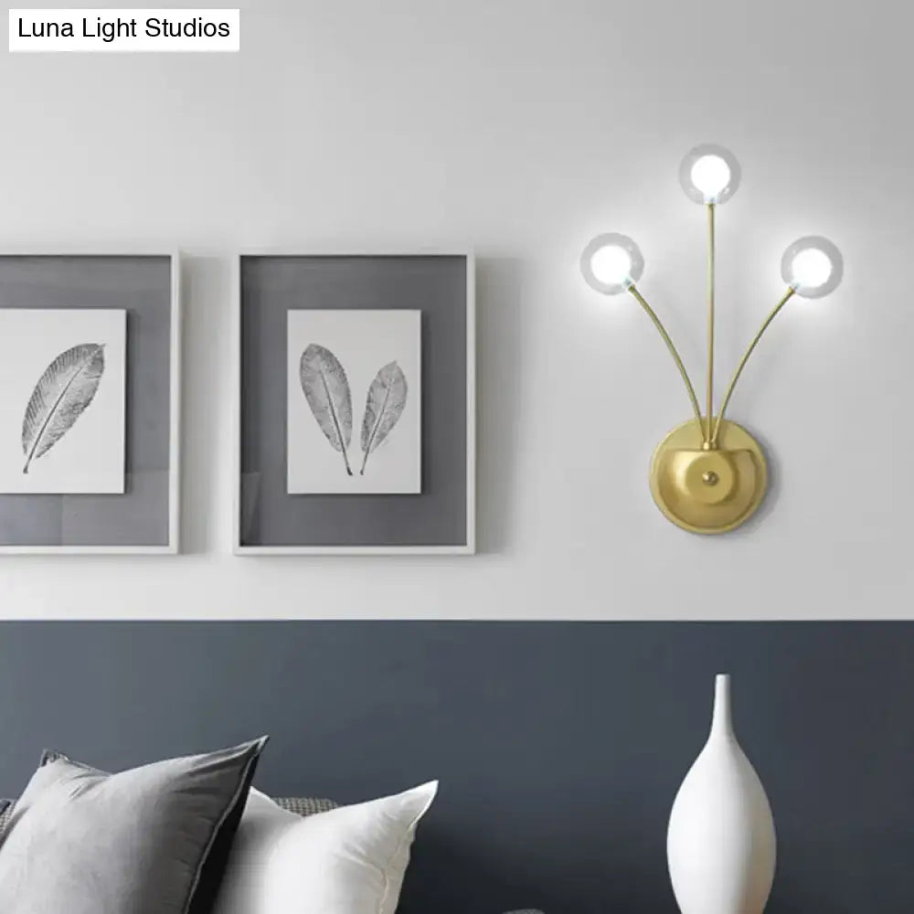 Black Iron Globe Sconce by Decorbites with three gold stems and white bulbs, brass mount on Tampa Home & Garden Store