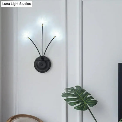 Black iron globe sconce with three curved arms and starburst bulbs, Decorbites wall light on Tampa Home & Garden Store