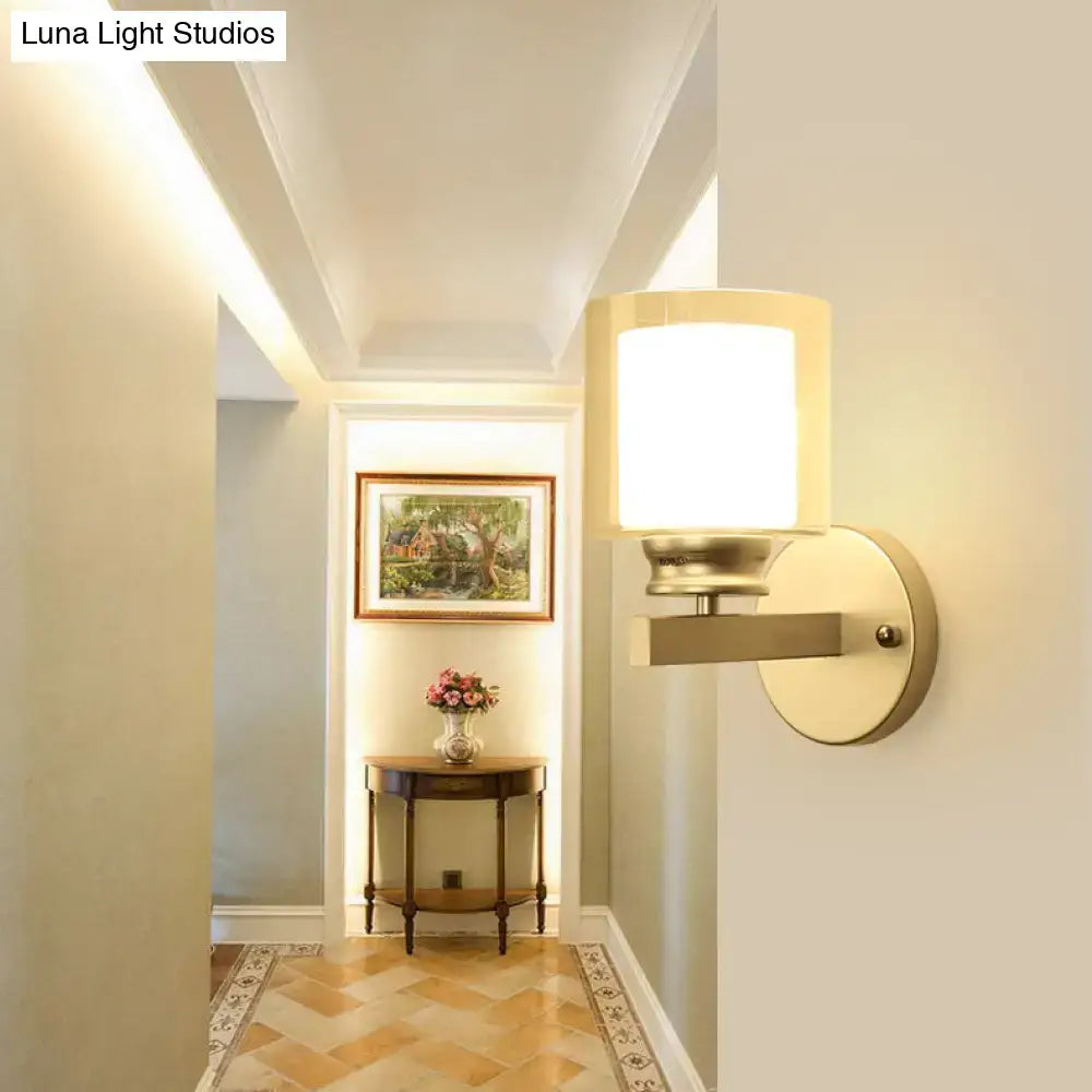 Black chrome glass sconce by Decorbites with cylindrical white glass shade on Tampa Home & Garden Store