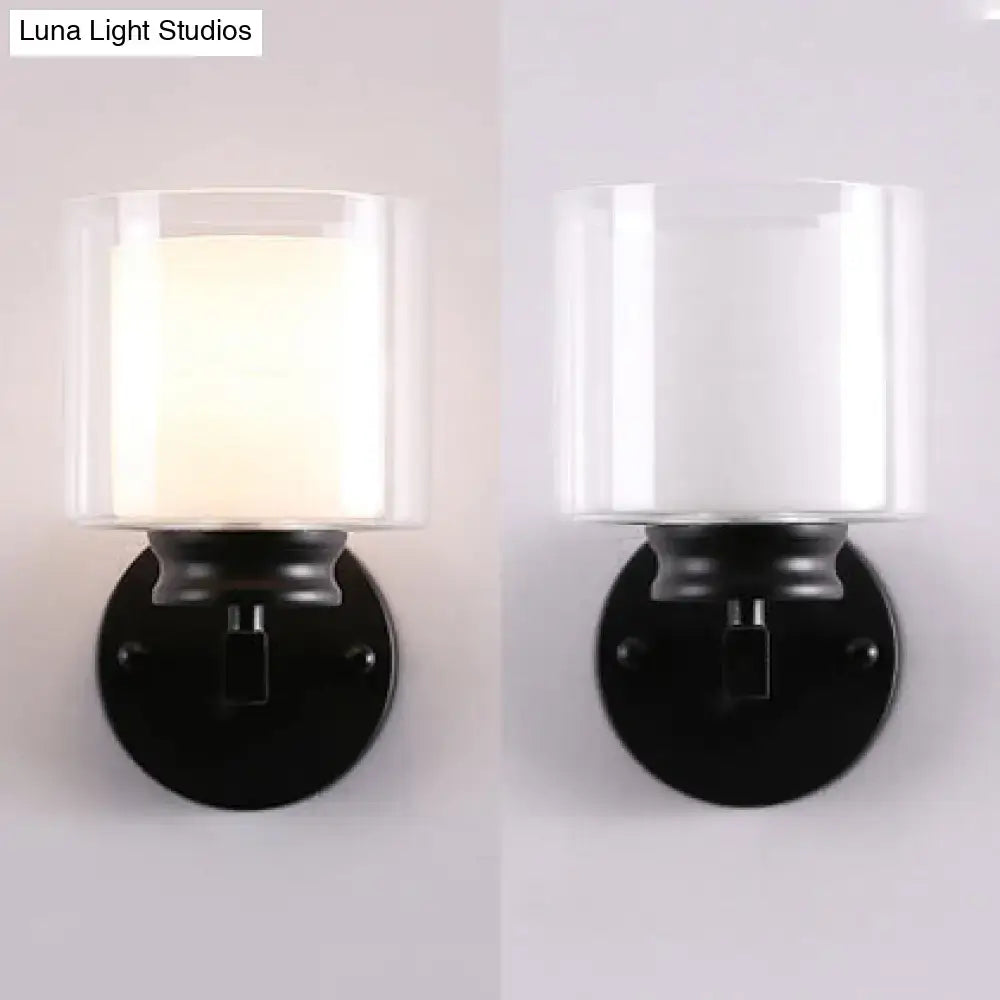 Two black chrome glass wall sconces with frosted shade and round black backplates Decorbites on Tampa Home & Garden Store