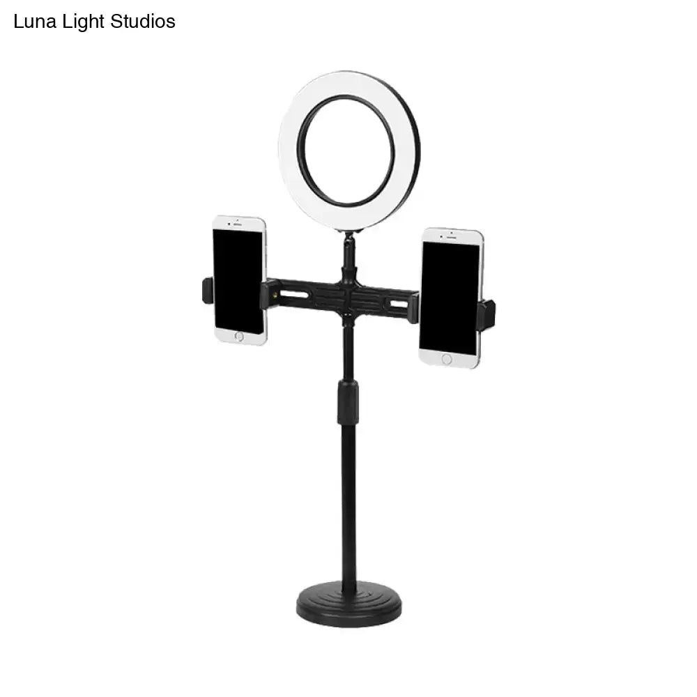 Black USB wall light with ring light and dual phone clamps on an adjustable tall stand on Tampa Home & Garden Store