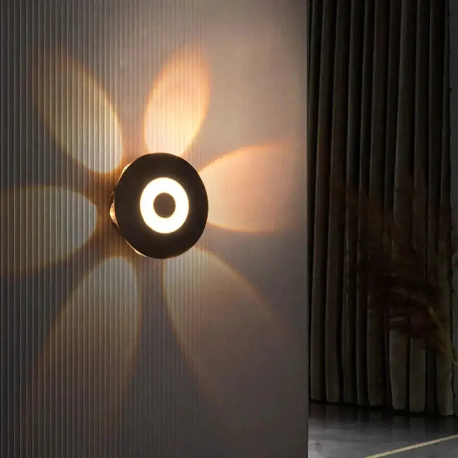 Modern black circular LED outdoor wall sconce by Decorbites on Tampa Home & Garden Store