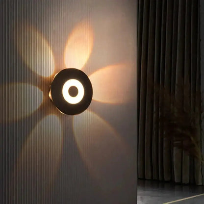 Modern black circular LED outdoor wall sconce by Decorbites on Tampa Home & Garden Store