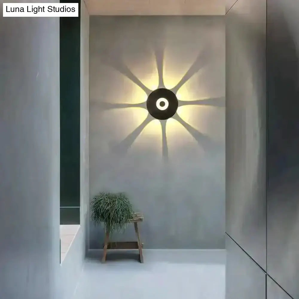 Modern black circular LED outdoor wall sconce by Decorbites with starburst halo, garden light on Tampa Home & Garden Store
