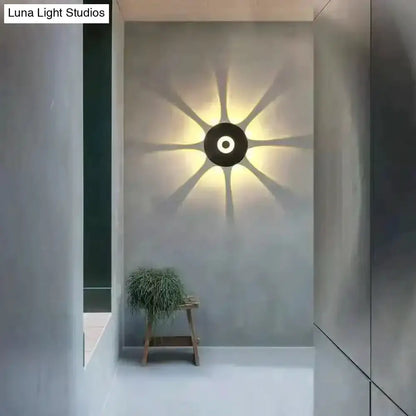 Modern black circular LED outdoor wall sconce by Decorbites with starburst halo, garden light on Tampa Home & Garden Store