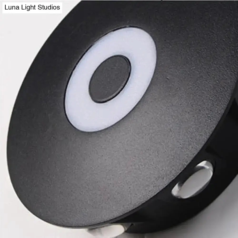 Modern black circular LED outdoor wall sconce by Decorbites with white ring detail on Tampa Home & Garden Store