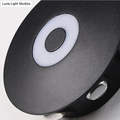 Modern black circular LED outdoor wall sconce by Decorbites with white ring detail on Tampa Home & Garden Store