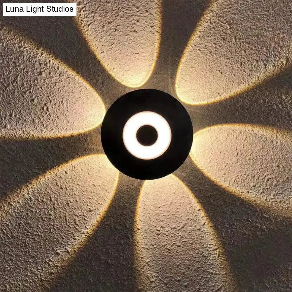 Modern black circular LED outdoor wall sconce garden light by Decorbites with warm white glow on Tampa Home & Garden Store
