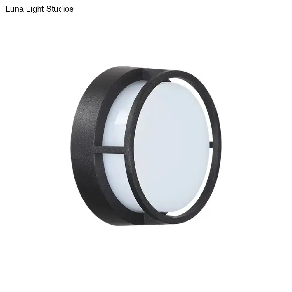 Decorbites modern circular LED wall lamp with black metal frame and white diffuser outdoor on Tampa Home & Garden Store