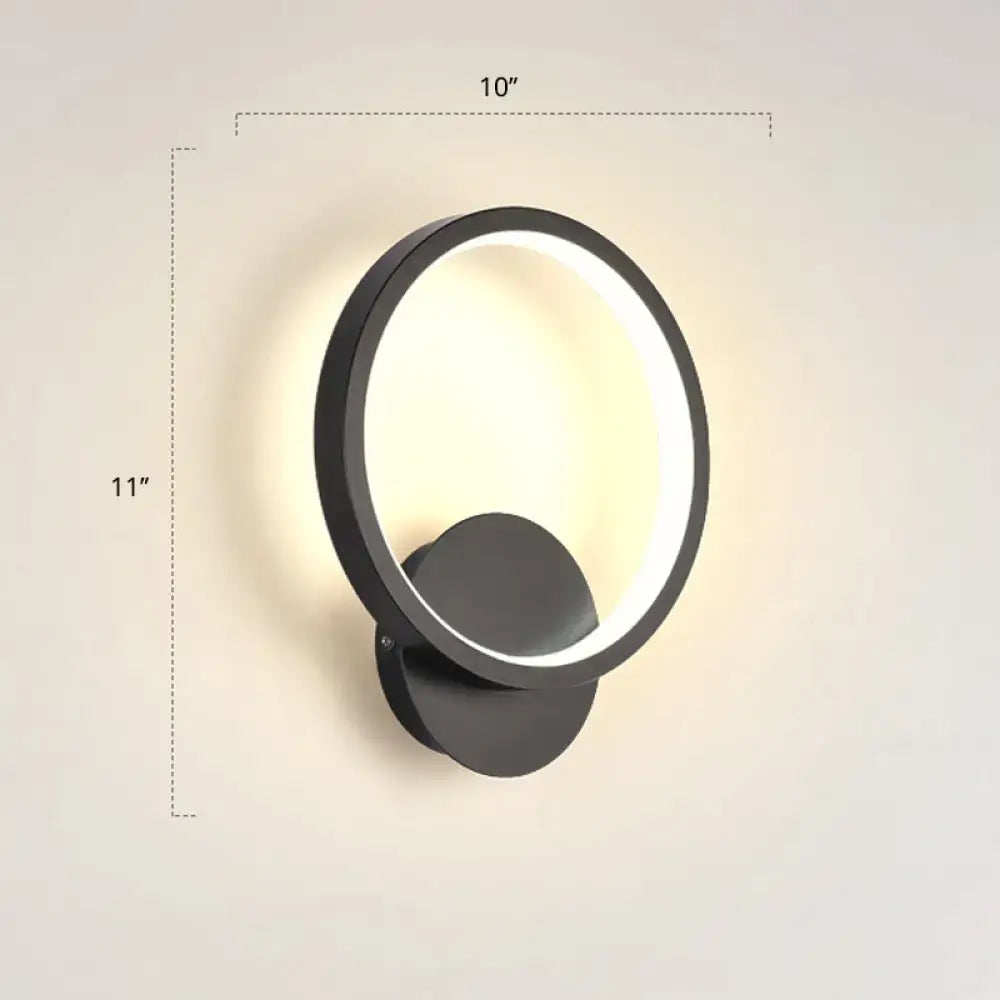 Black circular LED wall sconce by Decorbites with illuminated ring and wall mount on Tampa Home & Garden Store