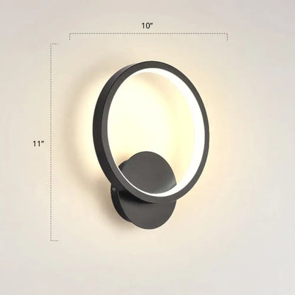 Black circular LED wall sconce by Decorbites with illuminated ring and wall mount on Tampa Home & Garden Store