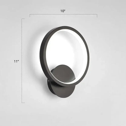 Black circular LED wall sconce with glowing ring, wall-mounted by Decorbites on Tampa Home & Garden Store