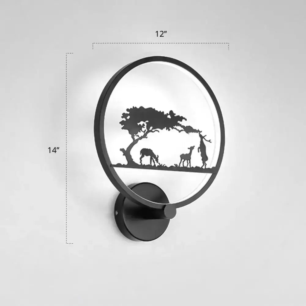 Black circular LED wall sconce by Decorbites with tree and grazing silhouettes on Tampa Home & Garden Store