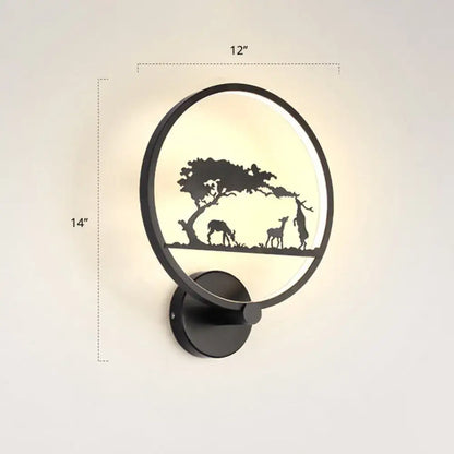 Black circular LED wall sconce by Decorbites with a nature silhouette scene on Tampa Home & Garden Store