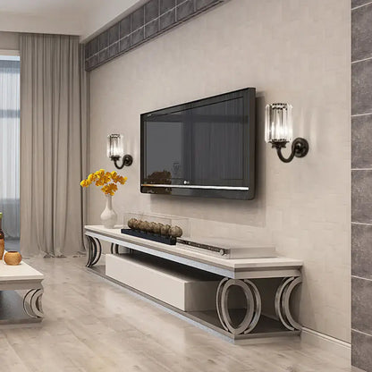 Pair of Decorbites black crystal drum sconces with metal arms beside a wall-mounted TV on Tampa Home & Garden Store