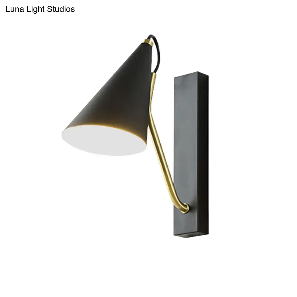 Black cone wall sconce with brass curved arm and rectangular backplate by Decorbites on Tampa Home & Garden Store