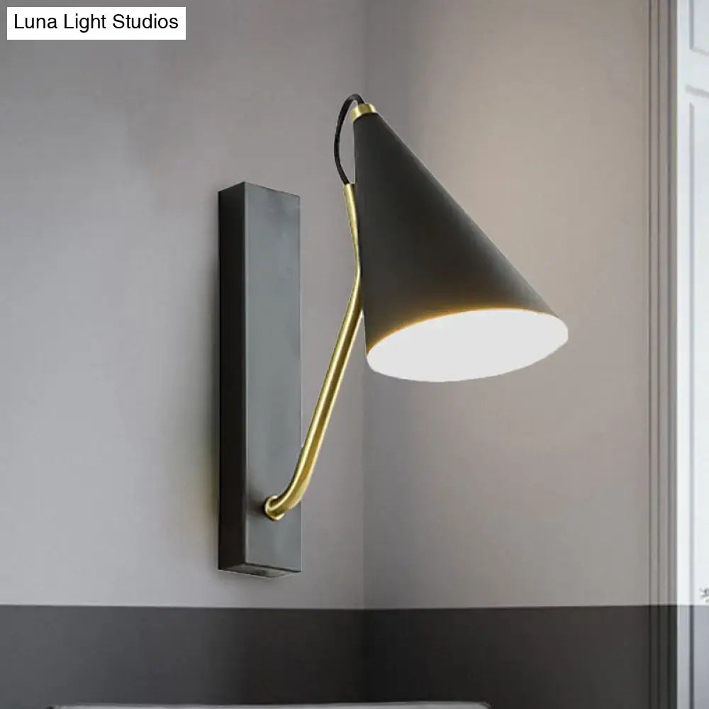 Black cone wall sconce with brass curved arm and rectangular backplate by Decorbites on Tampa Home & Garden Store