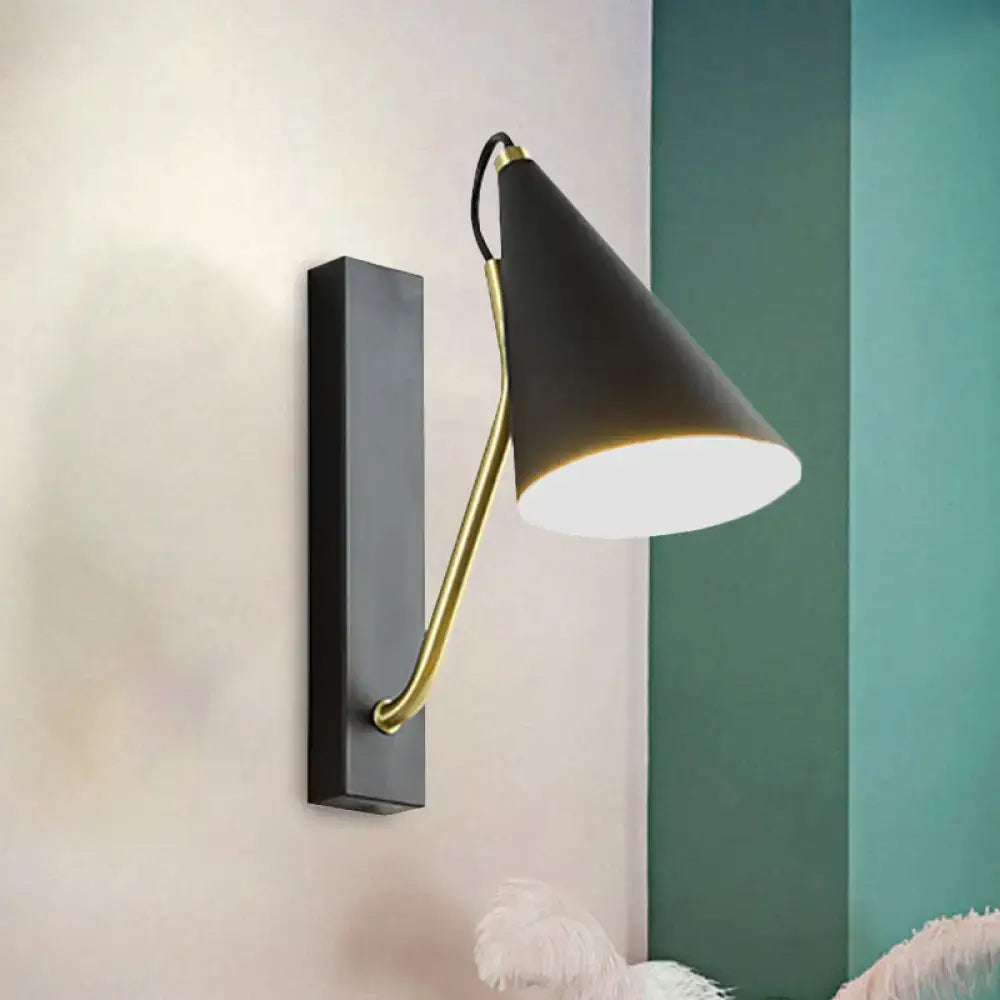 Black cone wall sconce with brass curved arm and black backplate by Decorbites on Tampa Home & Garden Store