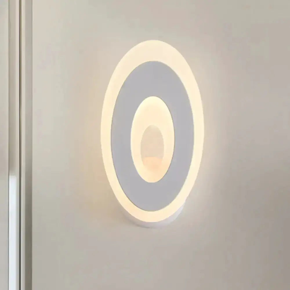 Modern oval LED wall lamp in black and cream with dual concentric rings for bedroom lighting on Tampa Home & Garden Store