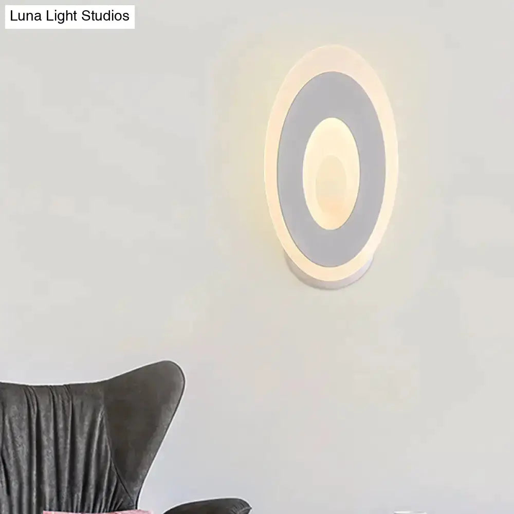 Oval LED wall lamp with concentric rings, black and cream design, Decorbites bedroom light on Tampa Home & Garden Store