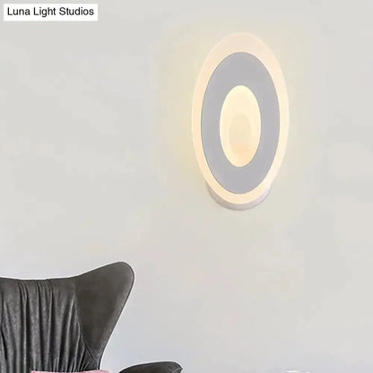 Oval LED wall lamp with concentric rings, black and cream design, Decorbites bedroom light on Tampa Home & Garden Store