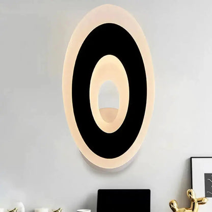 Oval LED wall lamp in black and cream by Decorbites for bedroom on Tampa Home & Garden Store