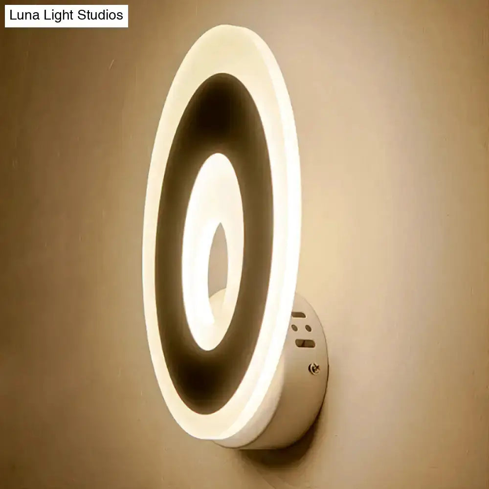 Modern oval LED wall lamp two-tone black and cream by Decorbites for bedroom lighting on Tampa Home & Garden Store