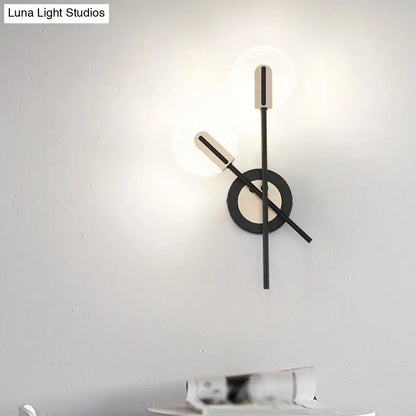 Black cast iron wall sconce with circular backplate and dual glass tube lights Decorbites on Tampa Home & Garden Store