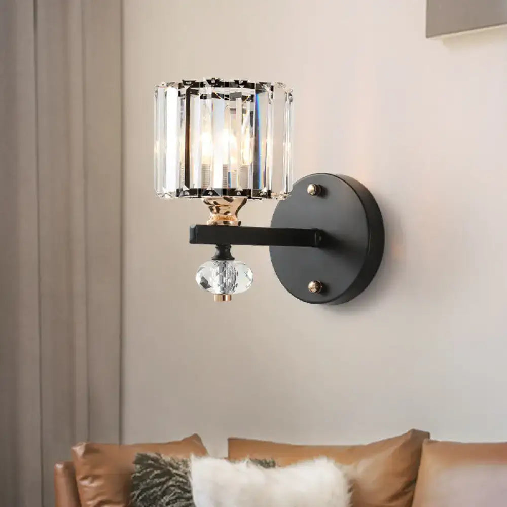 Black crystal drum sconce with black metal wall mount and hanging crystal pendant on Tampa Home & Garden Store