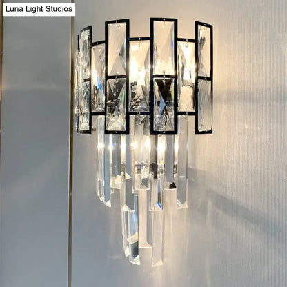 Black crystal embedded sconce with geometric black frame and hanging prisms by Decorbites on Tampa Home & Garden Store