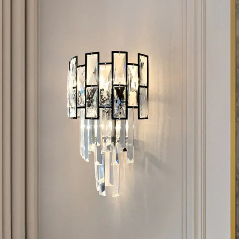 Black Crystal Embedded Sconce by Decorbites with black metal frame and hanging prisms on Tampa Home & Garden Store