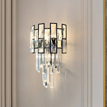 Black Crystal Embedded Sconce by Decorbites with black metal frame and hanging prisms on Tampa Home & Garden Store