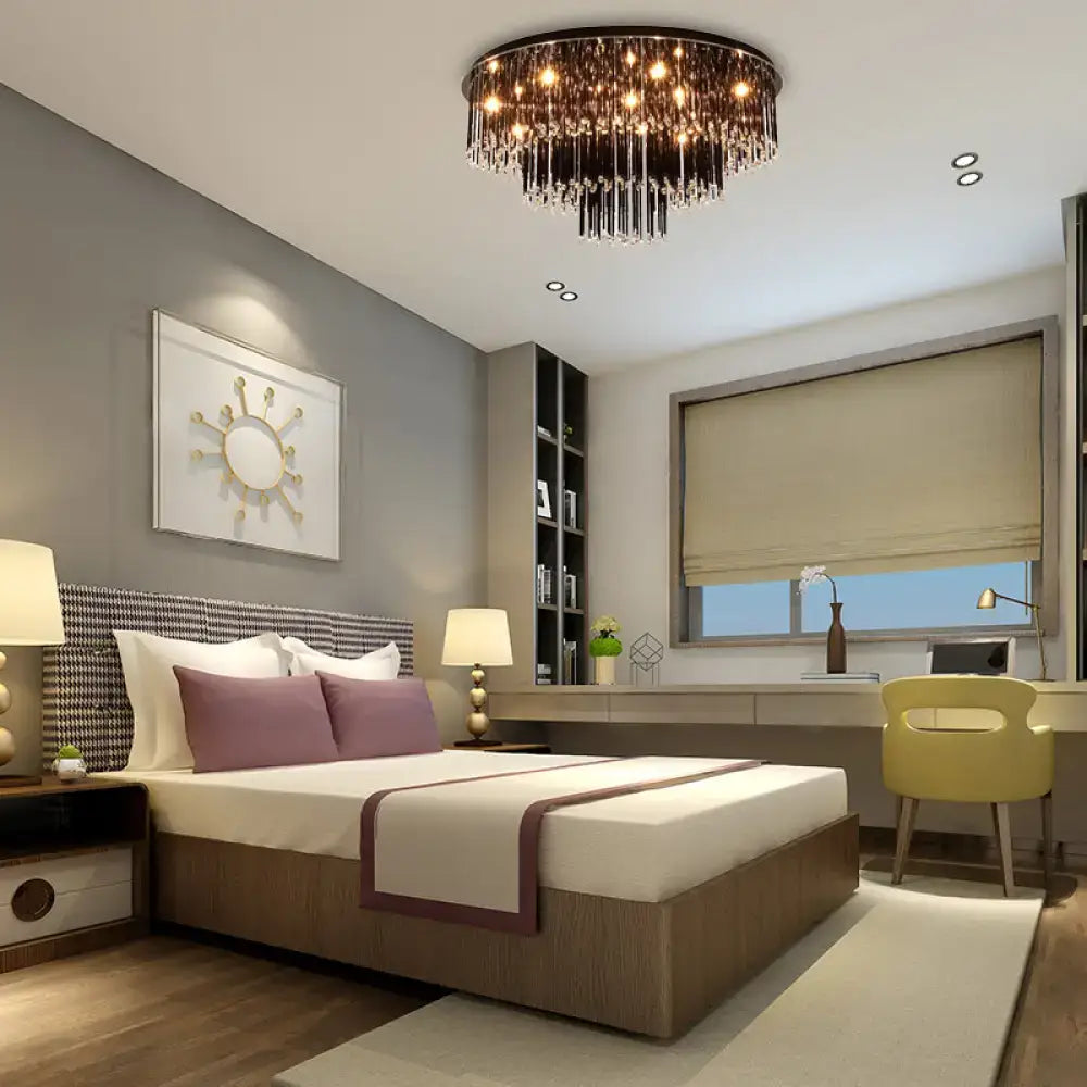 Black crystal bedroom chandelier by Decorbites over a modern gray bedroom with tufted headboard on Tampa Home & Garden Store