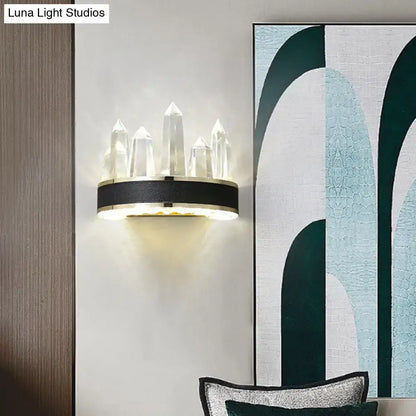 Black Icicle Wall Light by Decorbites, crystal icicle prisms atop a black band, warm glow on Tampa Home & Garden Store