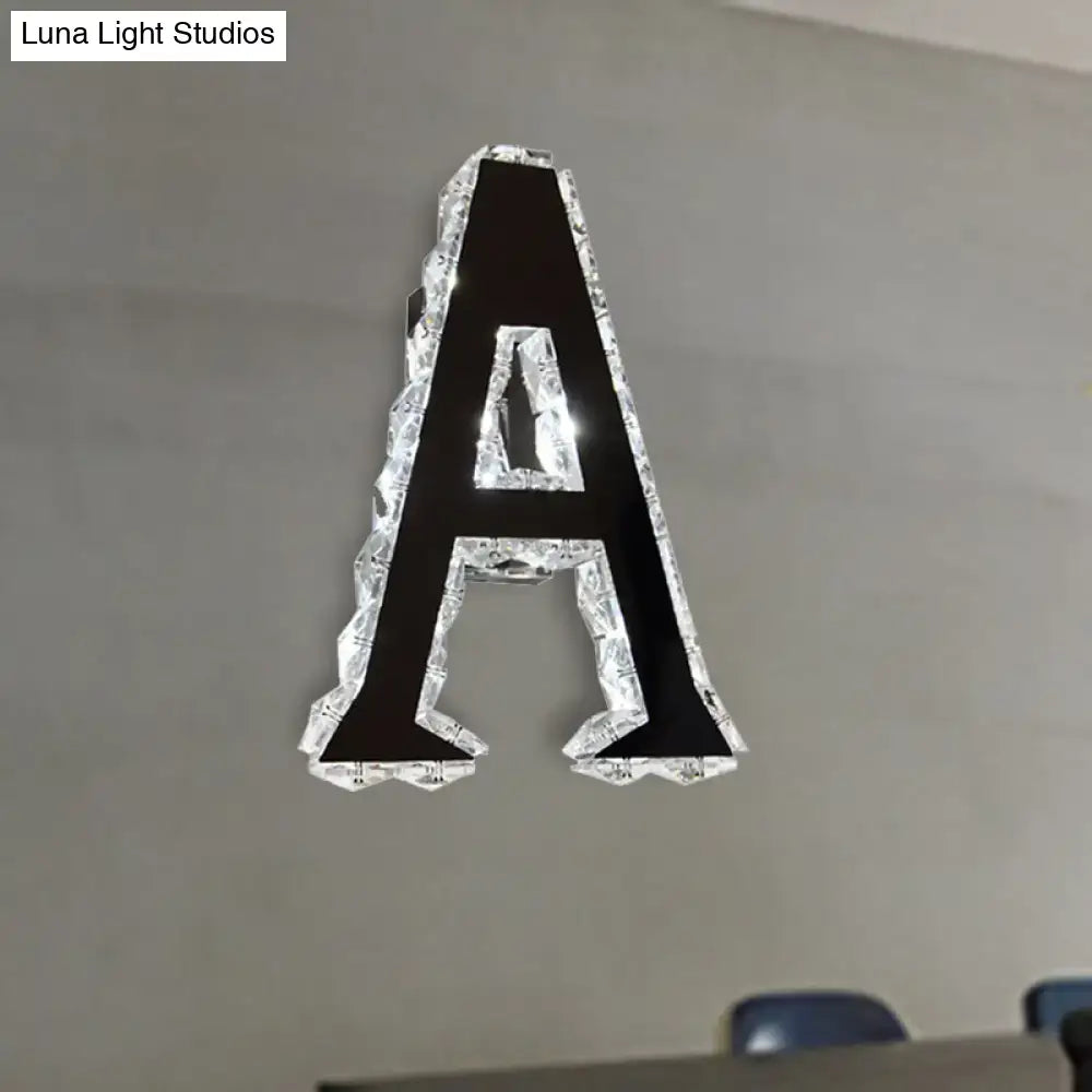 Black crystal letter A sconce with clear crystal border mounted on gray wall by Decorbites on Tampa Home & Garden Store
