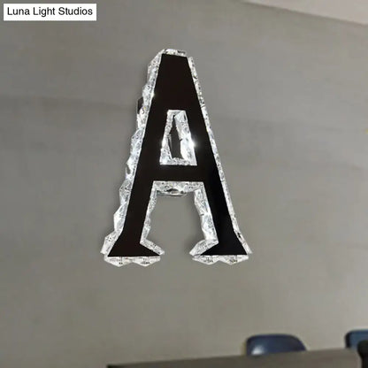 Black crystal letter A sconce with clear crystal border mounted on gray wall by Decorbites on Tampa Home & Garden Store