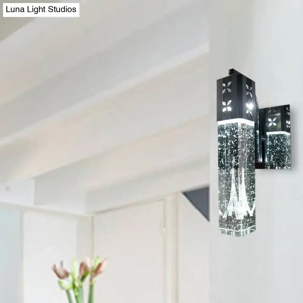 Nickel crystal wall sconce with black metal backplate and hanging crystal prism on Tampa Home & Garden Store