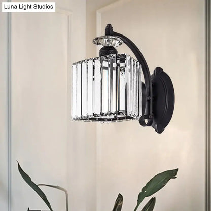 Decorbites black curved crystal wall sconce with vertical crystal prisms and mounting plate on Tampa Home & Garden Store