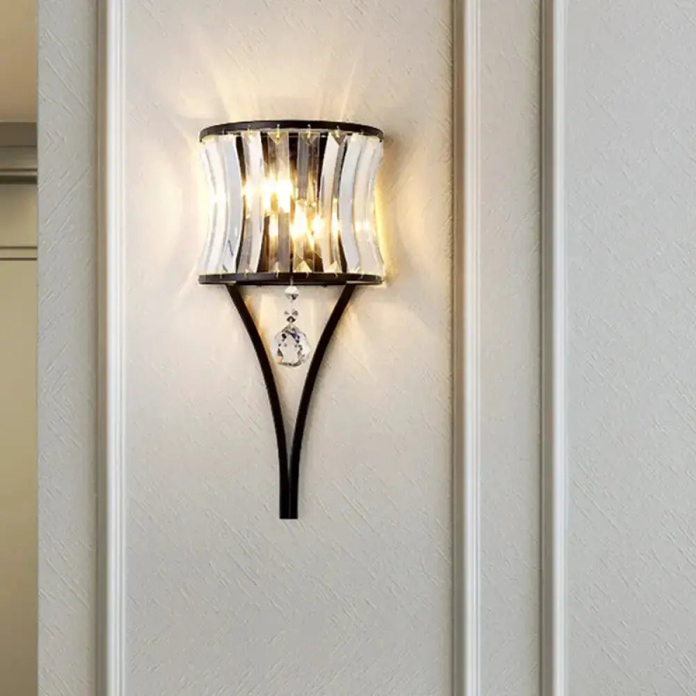 Modern black crystal wall sconce with curved metal frame and hanging crystals Decorbites on Tampa Home & Garden Store