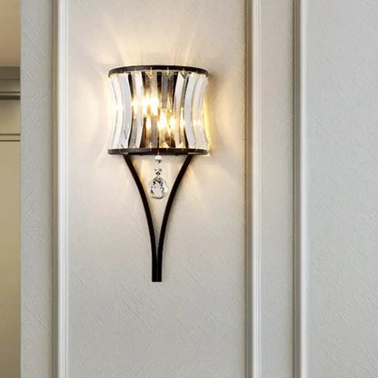 Modern black crystal wall sconce with curved metal frame and hanging crystals Decorbites on Tampa Home & Garden Store