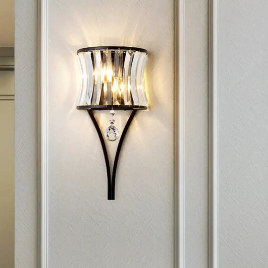 Modern black crystal wall sconce with curved metal frame and hanging crystals Decorbites on Tampa Home & Garden Store