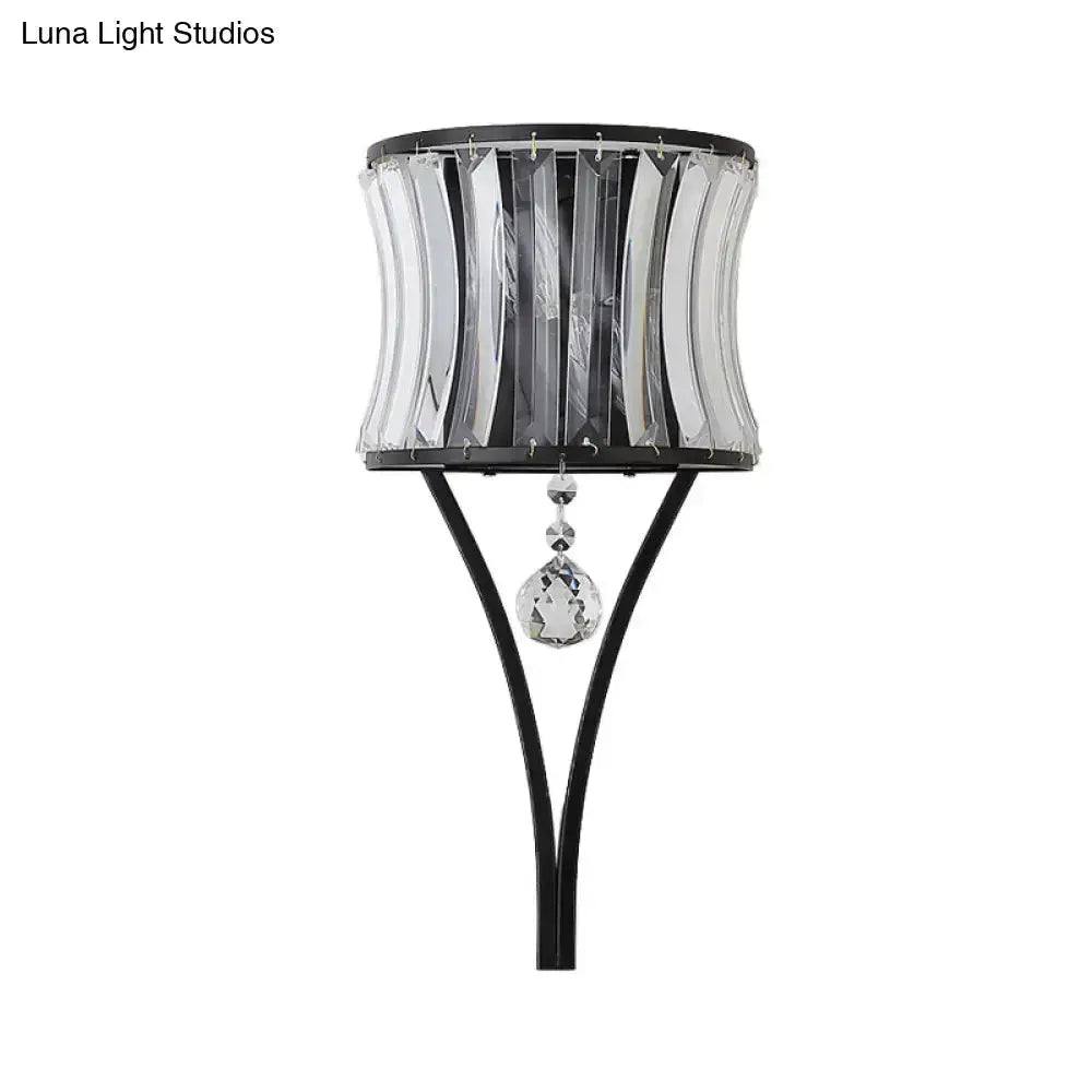 Modern black crystal wall sconce with curved crystal panels and hanging teardrop pendant on Tampa Home & Garden Store