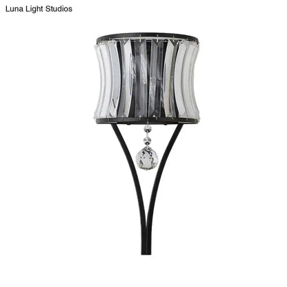 Modern black crystal wall sconce with curved crystal panels and hanging teardrop pendant on Tampa Home & Garden Store