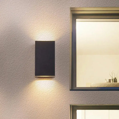 Black Cube LED Sconce by Decorbites, wall-mounted black metal exterior light with top glow on Tampa Home & Garden Store