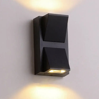 Black Cube LED Sconce by Decorbites, black metal wall light with stacked geometric blocks on Tampa Home & Garden Store