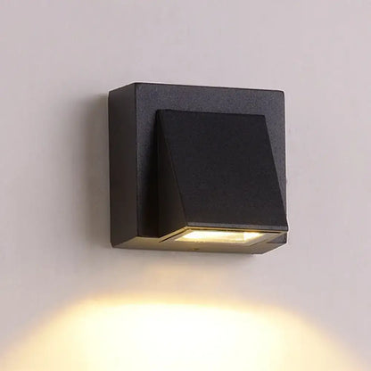 Black Cube LED Sconce wall light by Decorbites, black metal cube with warm downlight on Tampa Home & Garden Store
