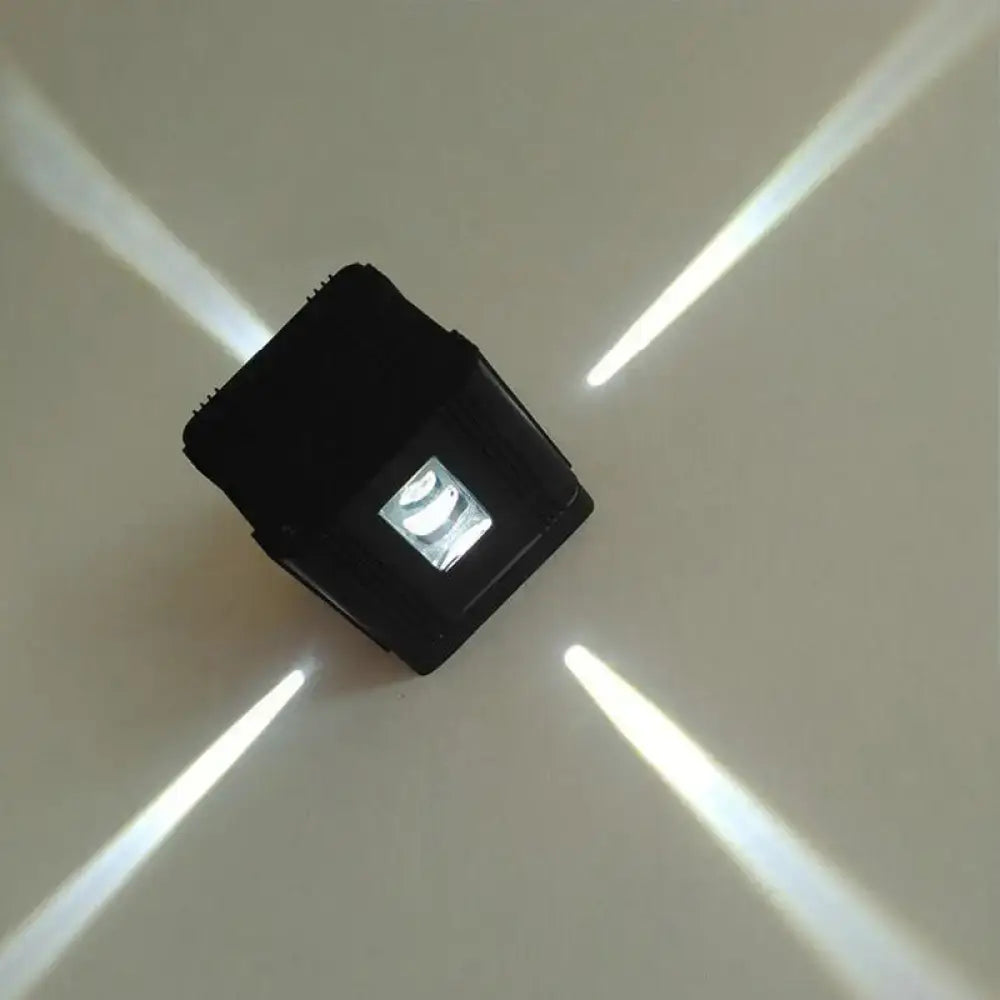 Black cubic LED sconce by Decorbites with visible LED module on Tampa Home & Garden Store