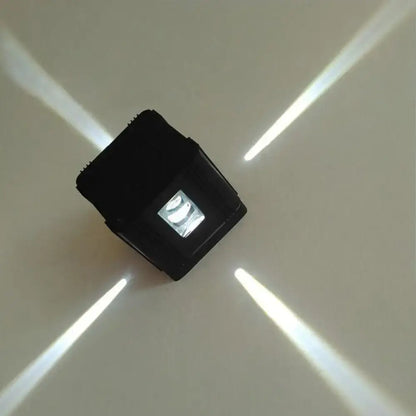 Black cubic LED sconce by Decorbites with visible LED module on Tampa Home & Garden Store