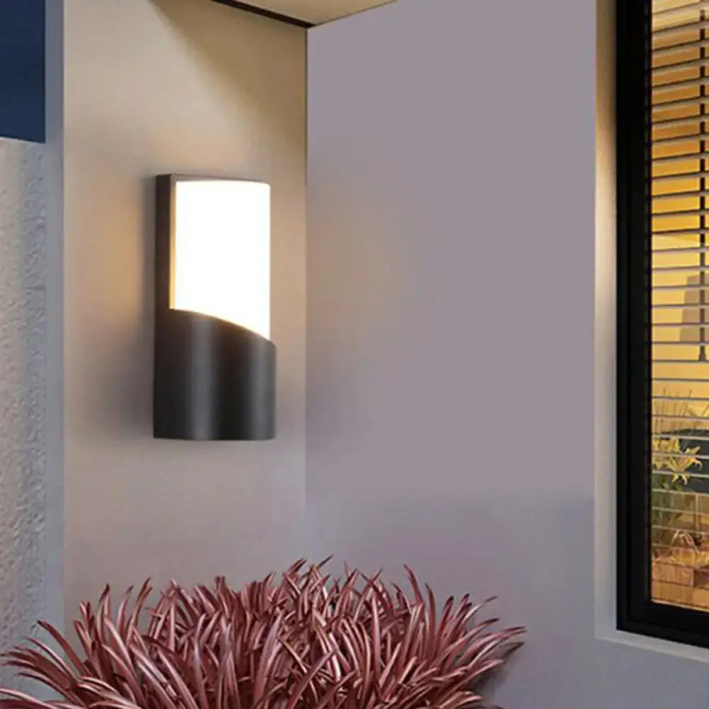 Black curved patio sconce with white glass panel, outdoor wall light on Tampa Home & Garden Store