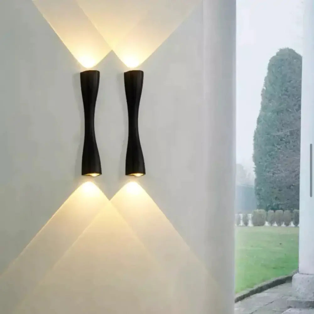 Black curved IP65 outdoor wall sconce pair by Decorbites with uplight and downlight on Tampa Home & Garden Store